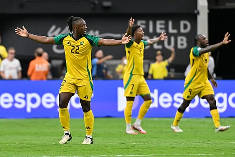 Jamaica players protest against referee's decision 